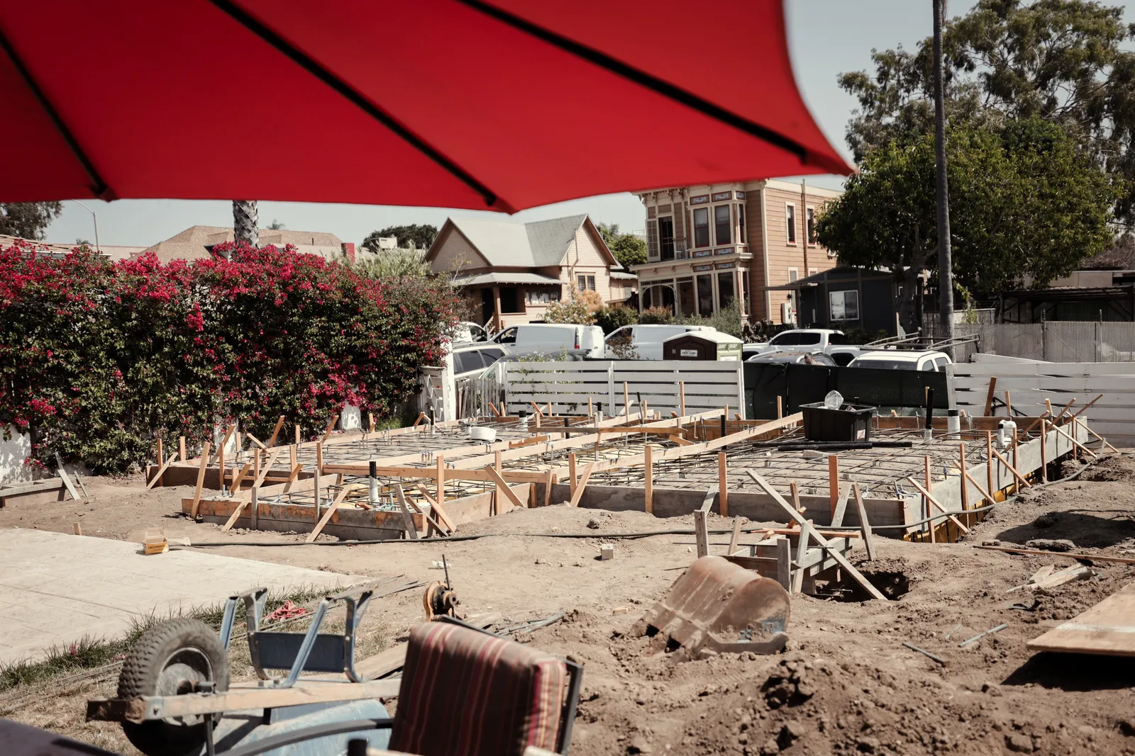 Framing and foundation work across the full lot