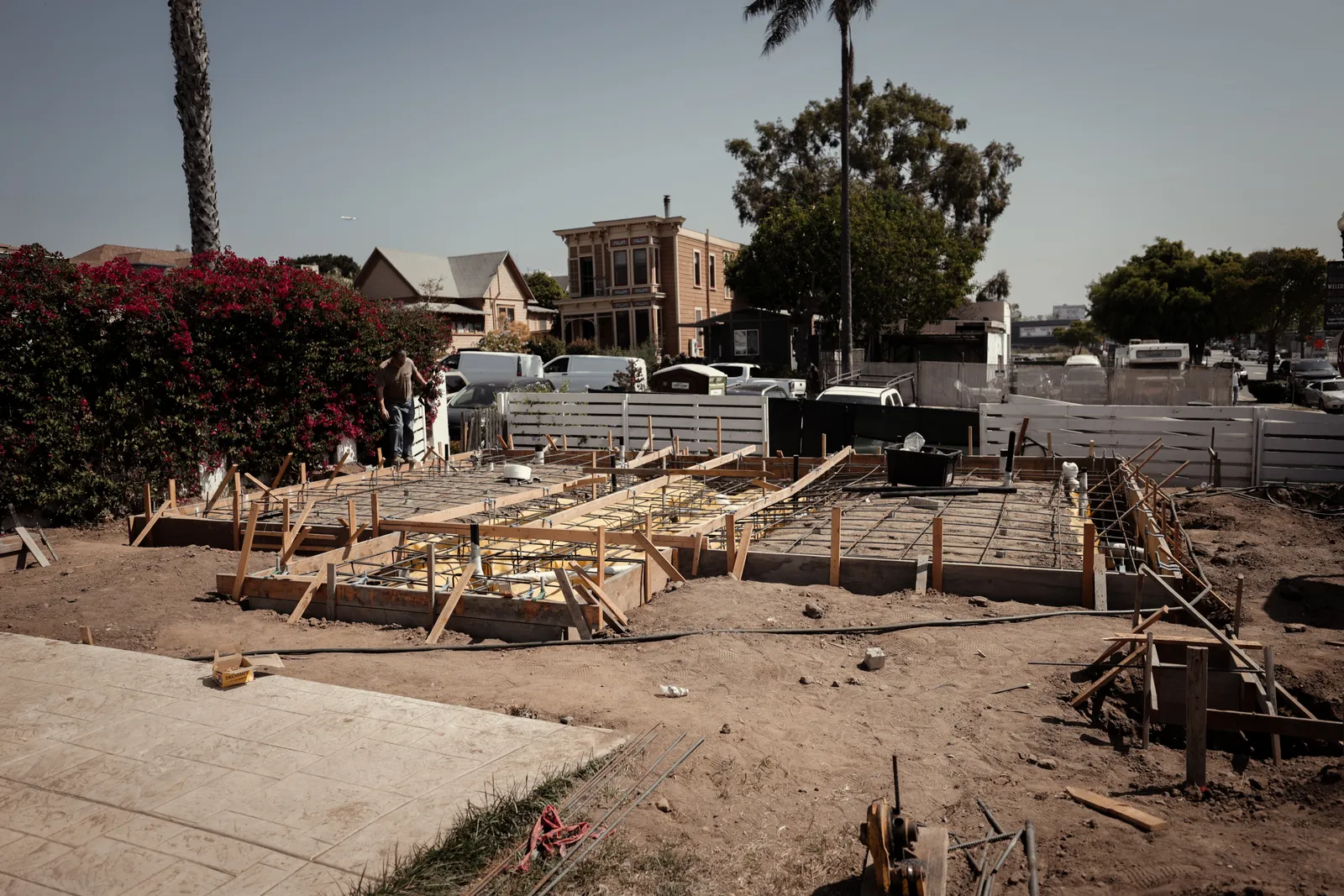 New framing rising from a poured foundation
