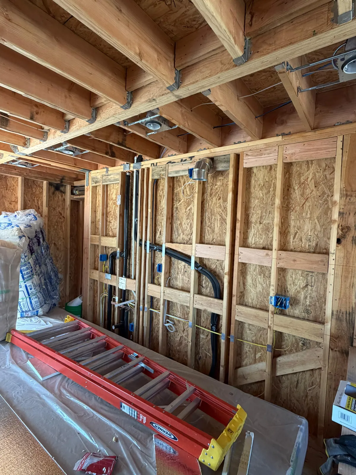 Interior framing with plumbing and electrical rough-in