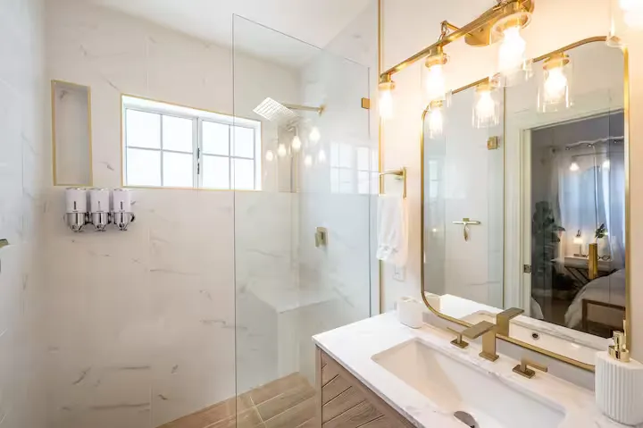 Master bathroom with marble shower and brass fittings