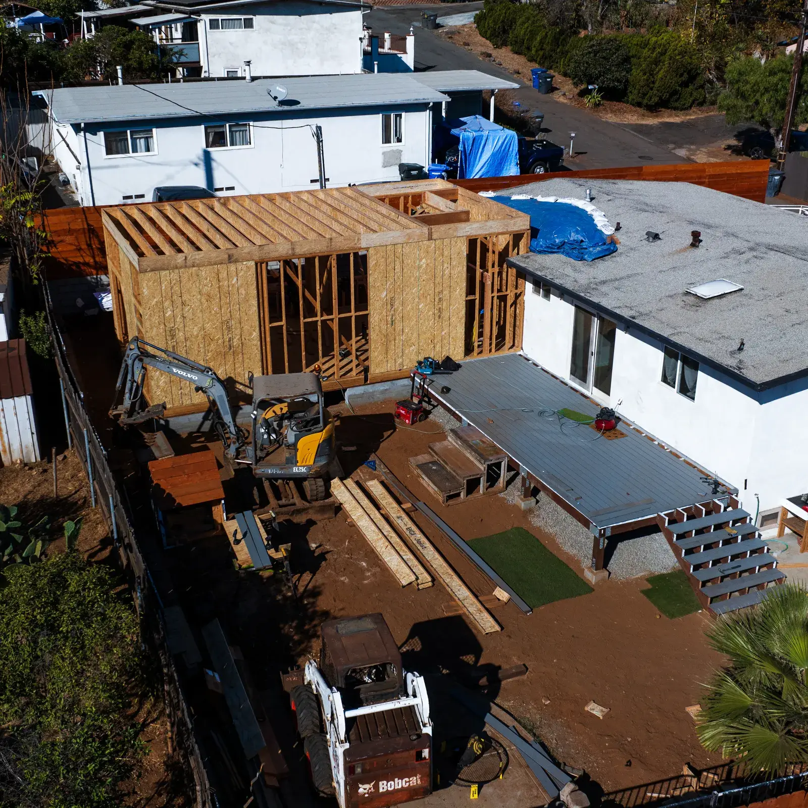 Spring Street — aerial, framing and the existing house