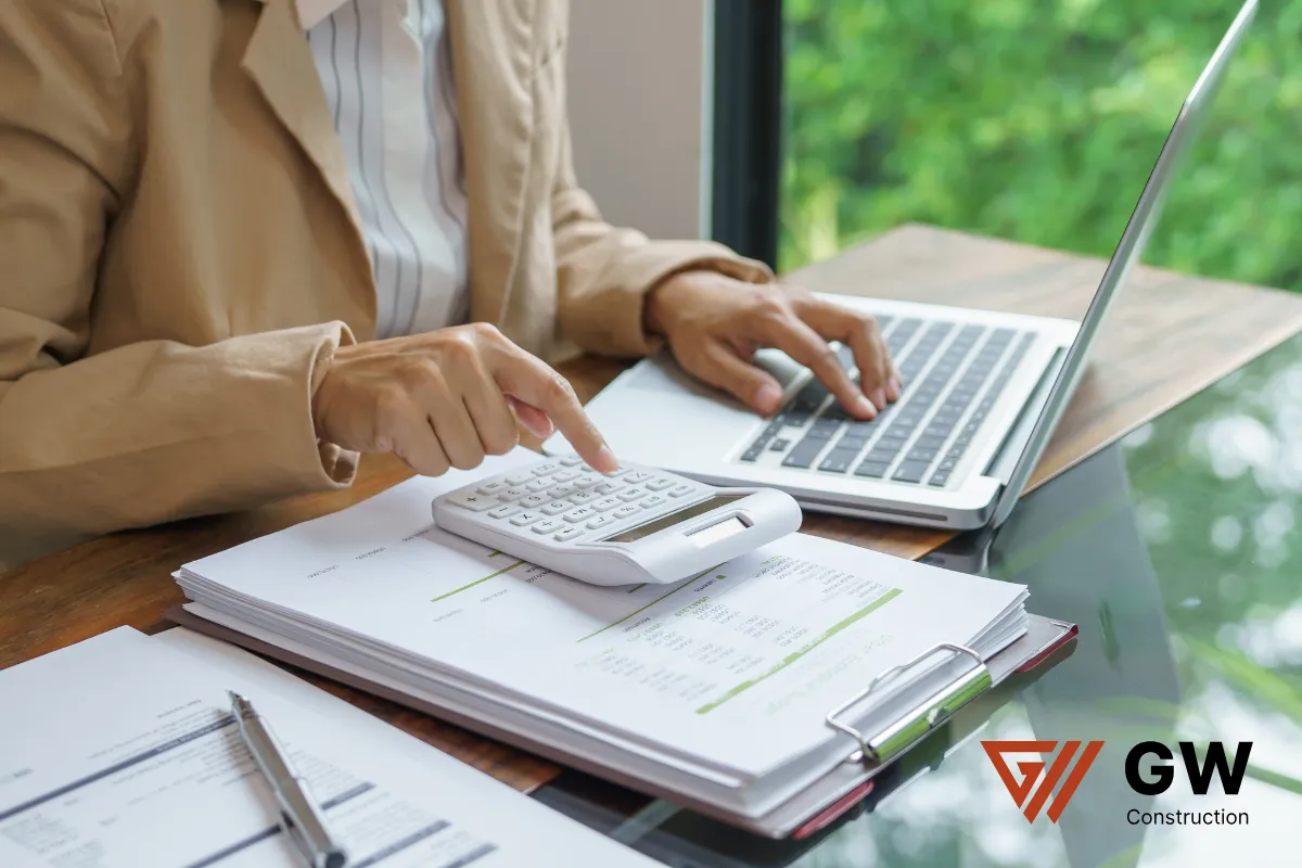 how-a-bad-inspection-report-can-be-a-budget-win Person calculating costs at desk